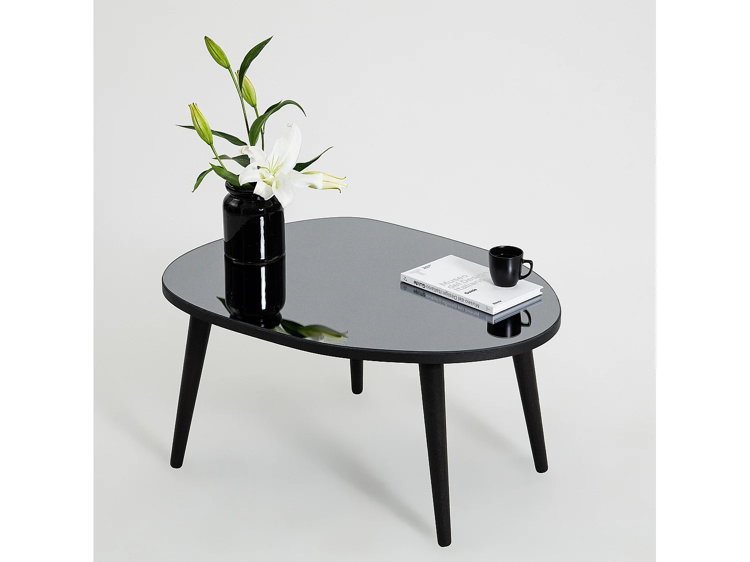 Table basse trépied ovale Casina 55x75cm Bois Noir et Verre trompé Miroir fumé