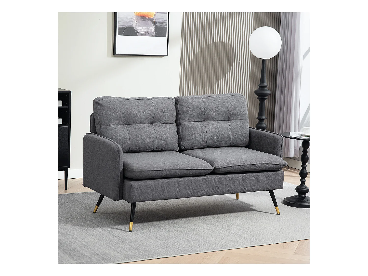 Canapé 2 places style art-déco dossier effet capitonné piètement incliné effilé métal noir extrémités dorées tissu anthracite