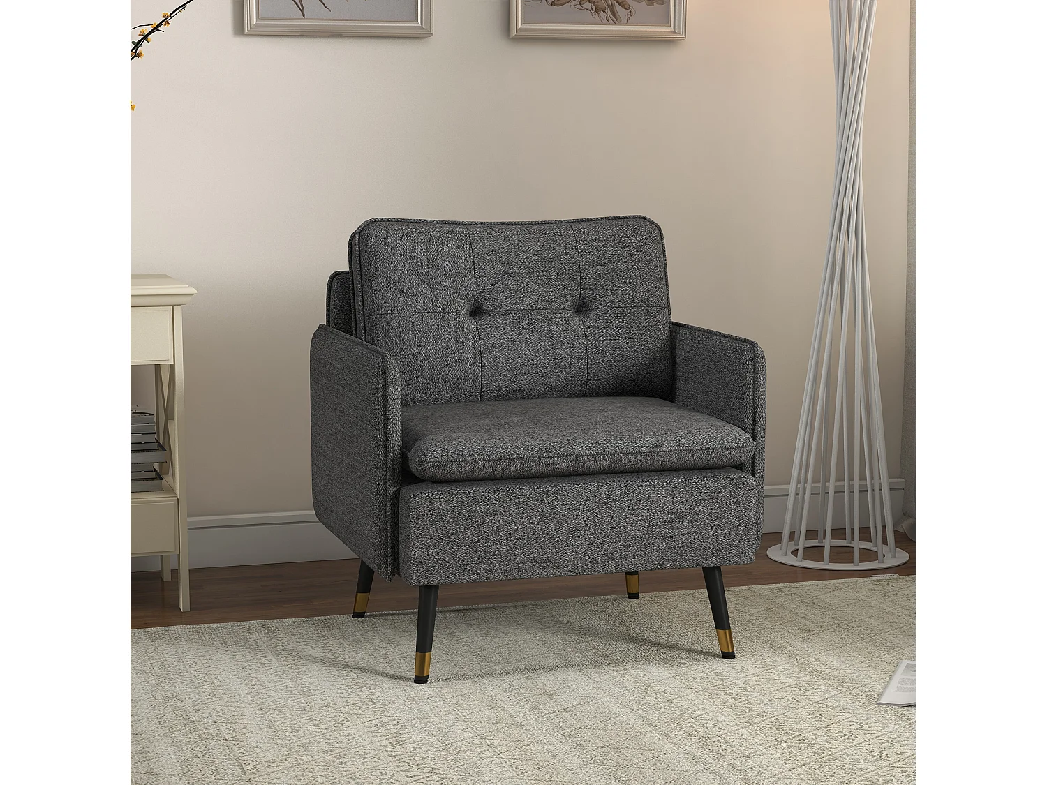 Fauteuil style art-déco dossier effet capitonné piètement incliné effilé métal noir extrémités dorées tissu anthracite