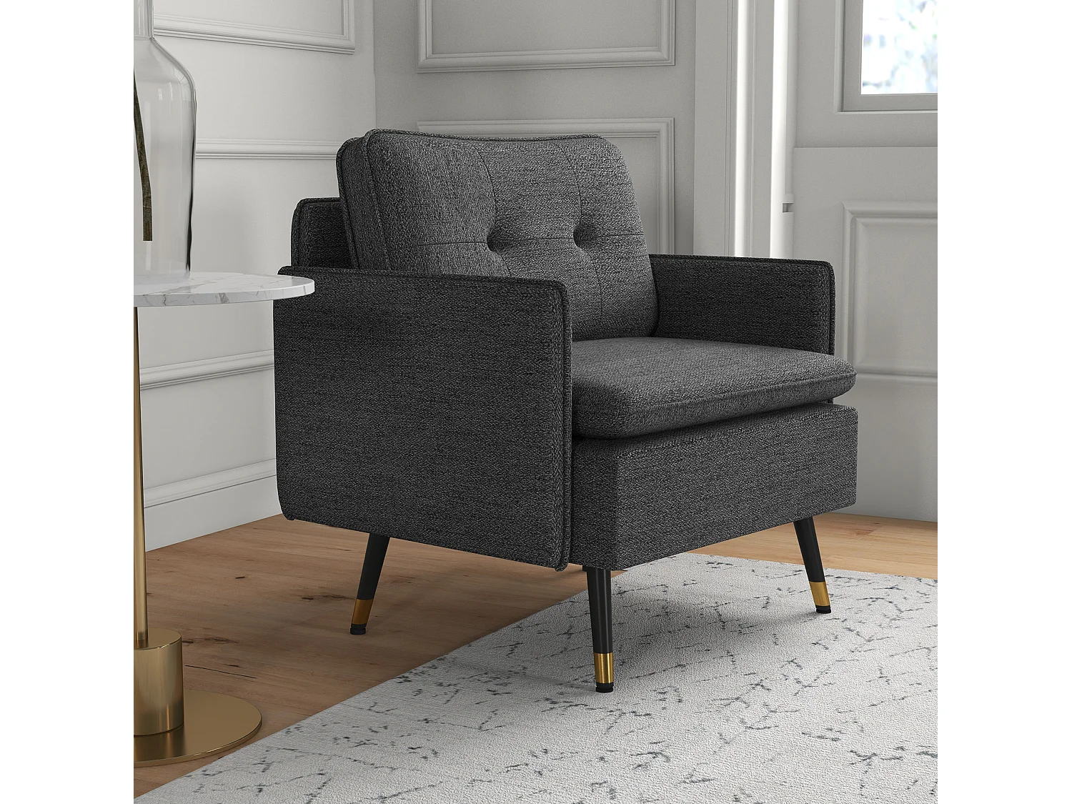 Fauteuil style art-déco dossier effet capitonné piètement incliné effilé métal noir extrémités dorées tissu anthracite