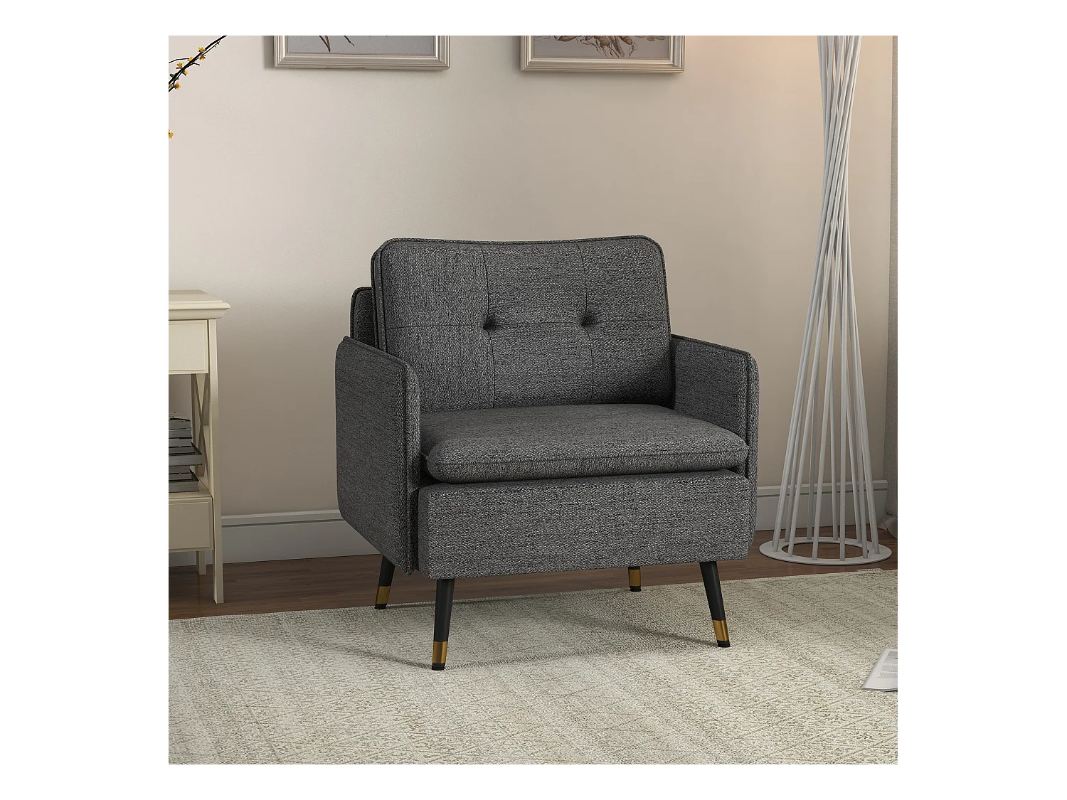 Fauteuil style art-déco dossier effet capitonné piètement incliné effilé métal noir extrémités dorées tissu anthracite