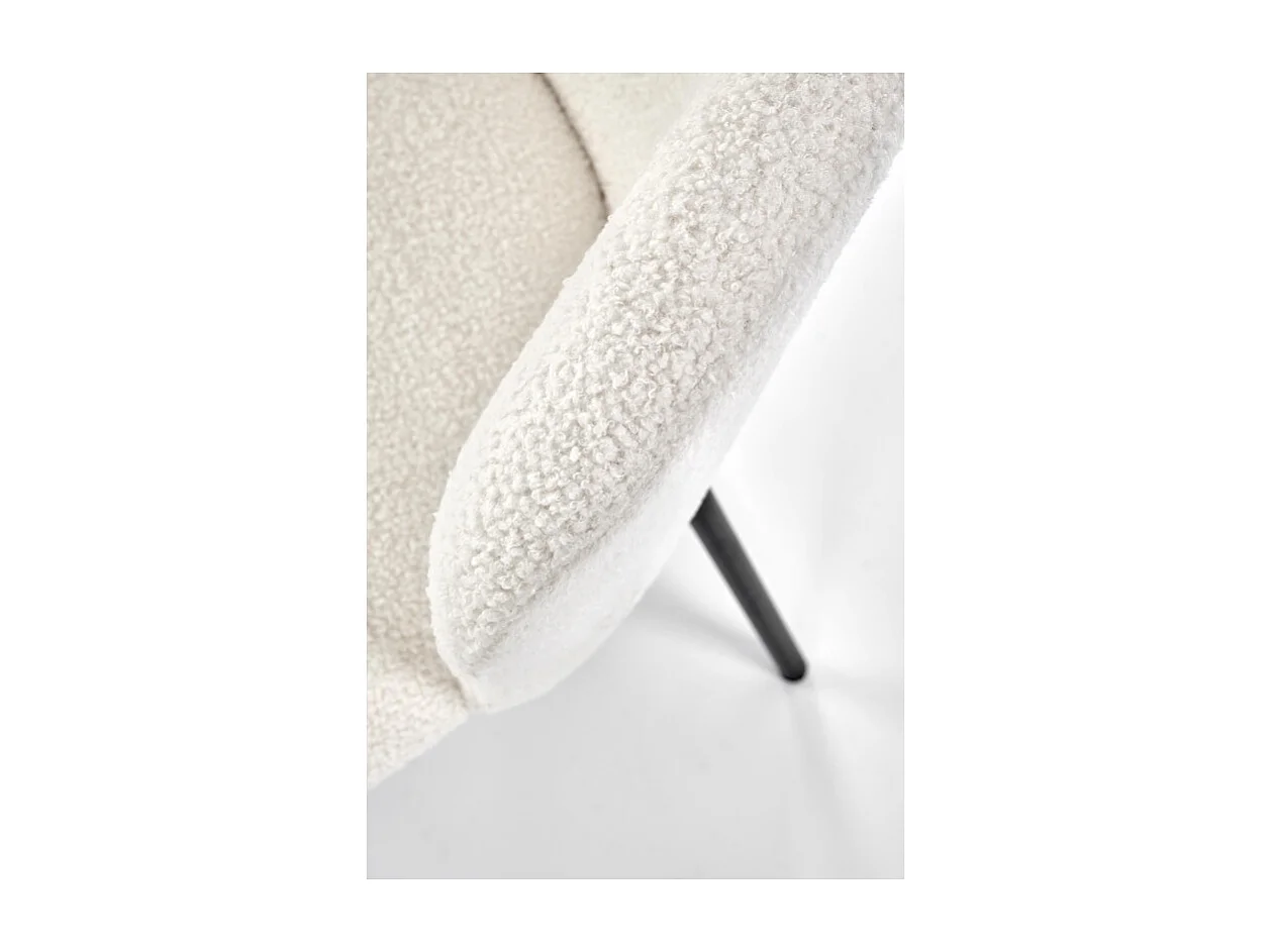 Chaise design en tissu bouclé crème avec pieds noirs en métal Schaff