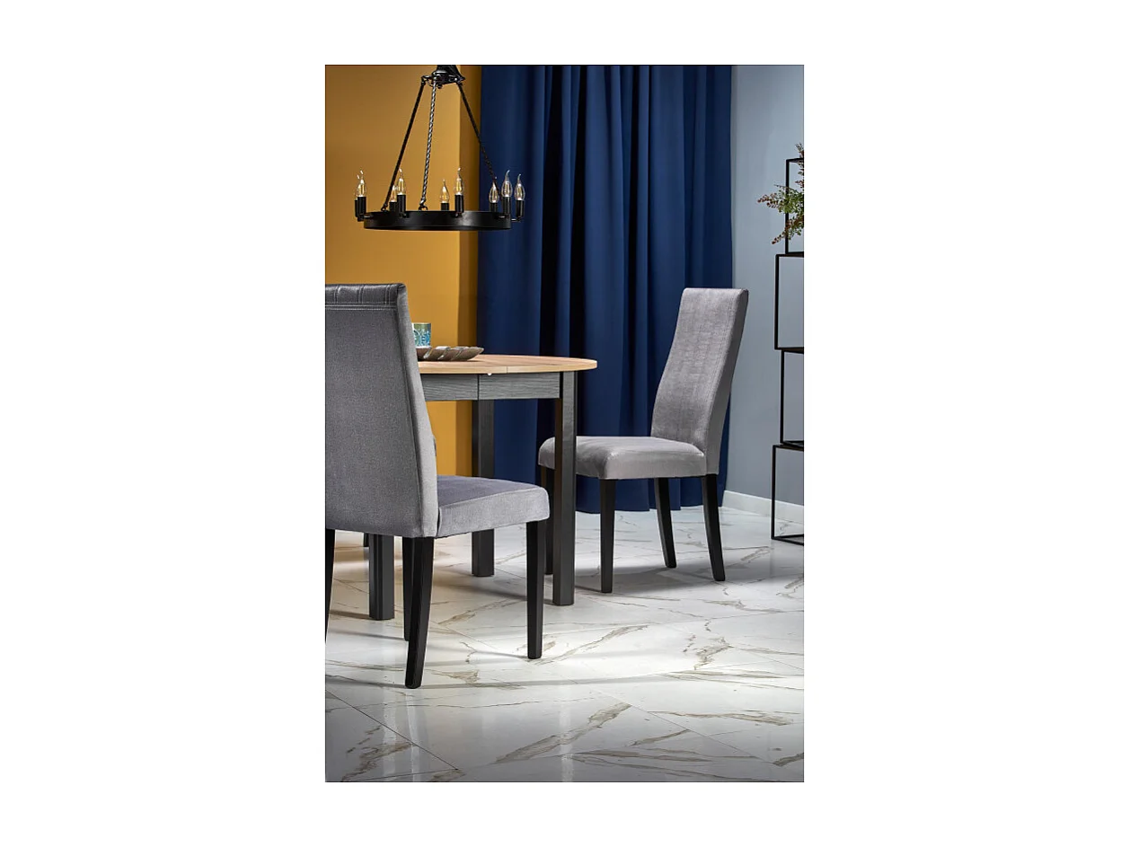 Tavolo da pranzo industriale rotondo allungabile con piano in rovere e gambe nere CARENE