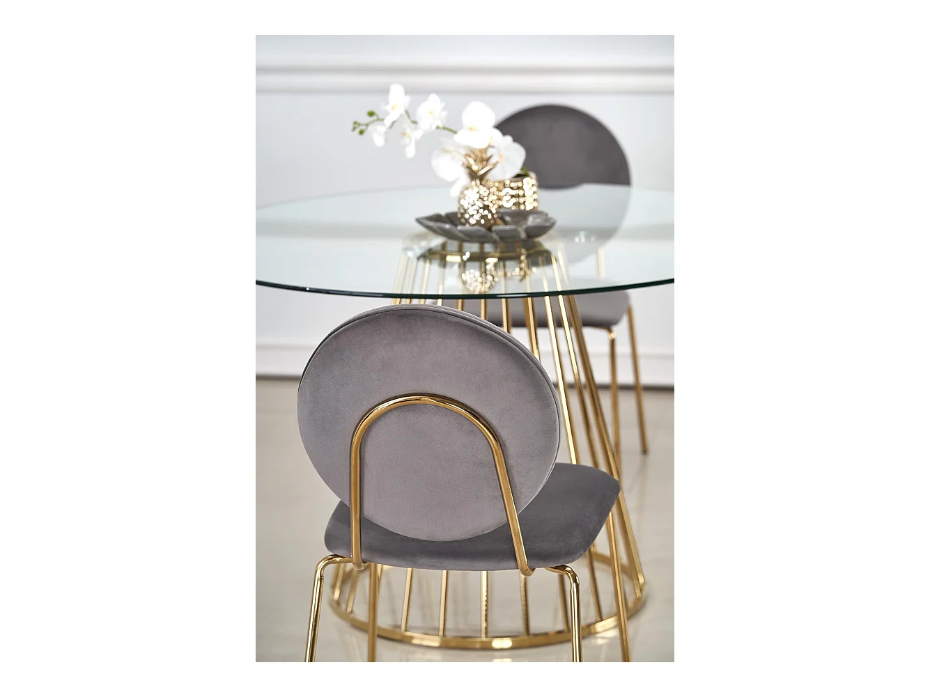 Mesa de comedor redonda con tapa de cristal y pata central de acero dorado Cambridge