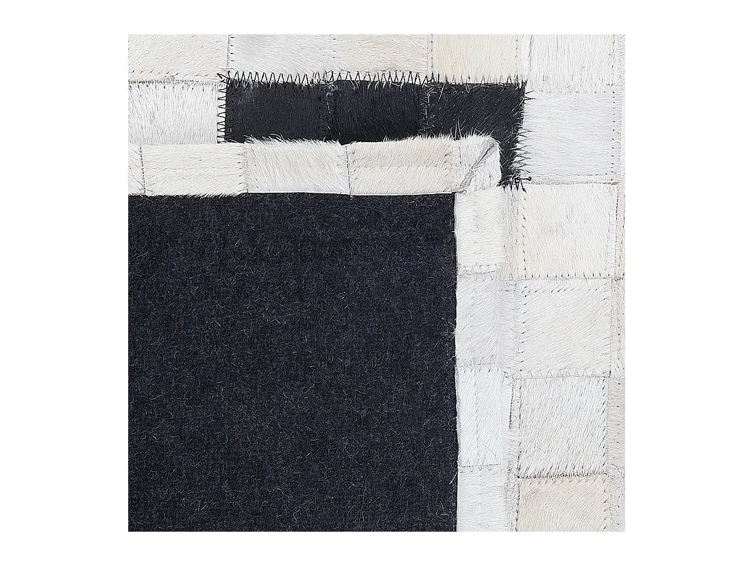 Moderner Teppich schwarz/weiß Echtleder 160 x 230 cm handgefertigt Bolu