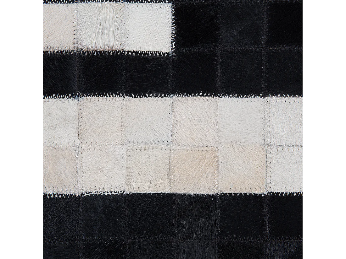 Moderner Teppich schwarz/weiß Echtleder 80 x 150 cm handgefertigt Bolu