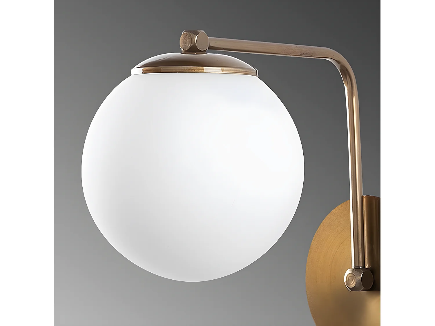 Applique Marga con struttura oro antico e sfera in vetro 1xE27