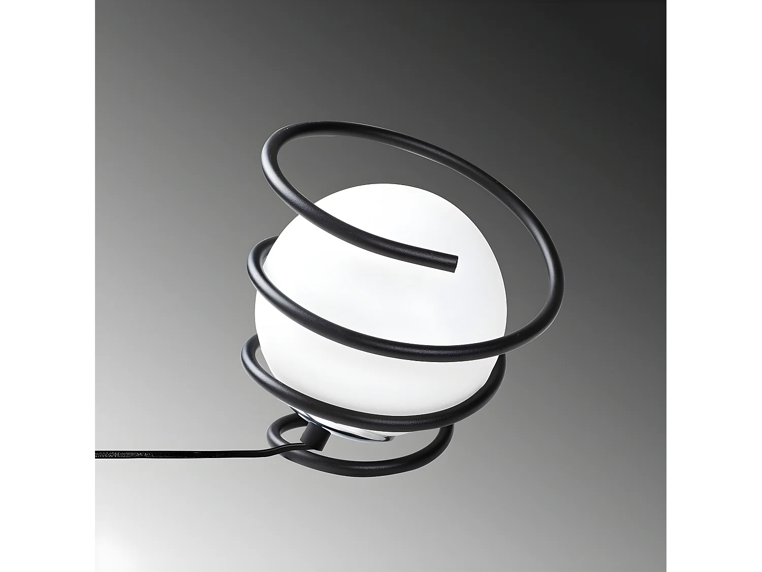 Lampe à poser Galene avec structure en spirale et sphère en verre 1xE27 - Noir