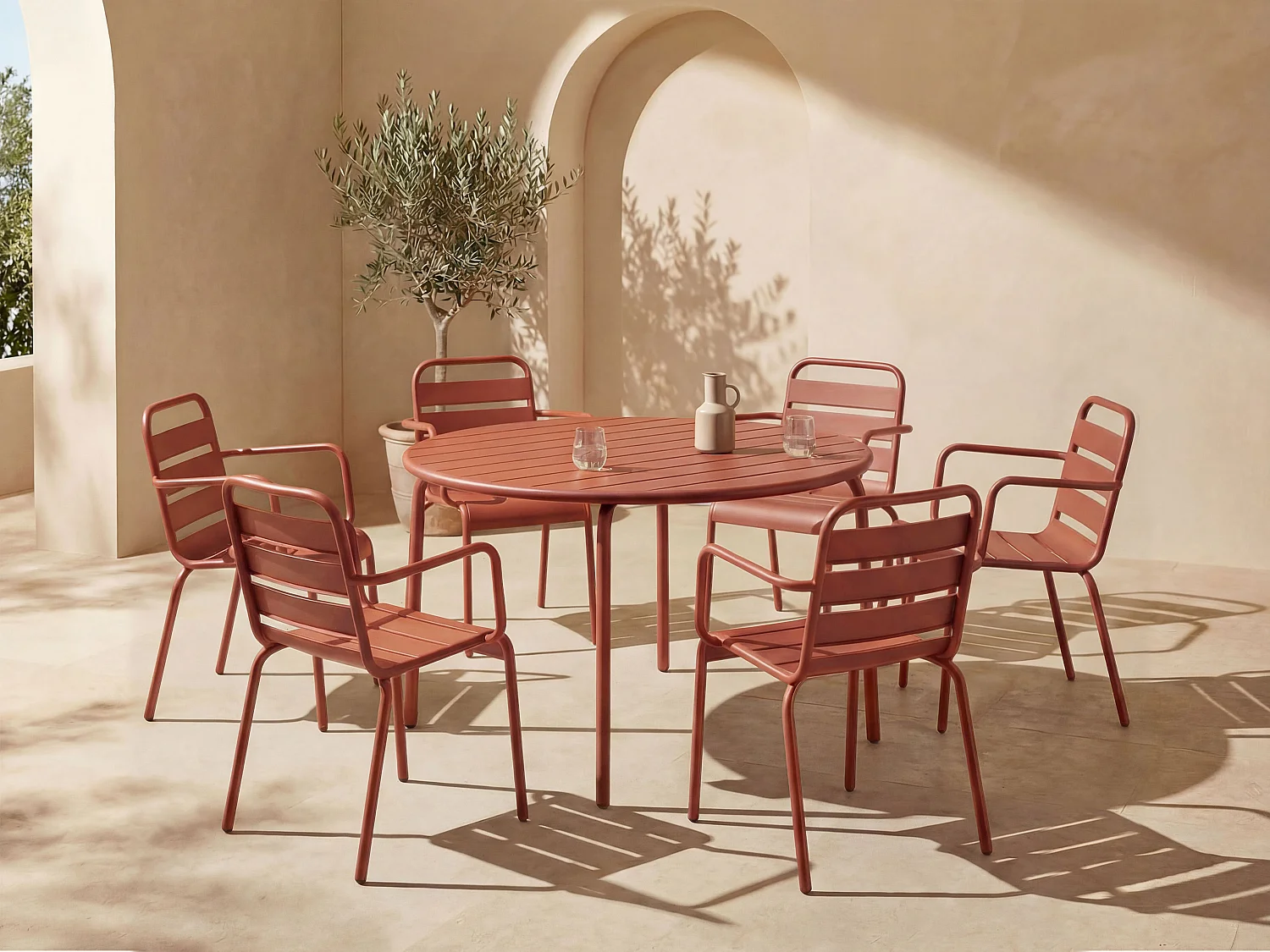 Salle à manger de jardin en métal - une table ronde D.130cm et 6 fauteuils empilables - Terracotta - MIRMANDE de MYLIA