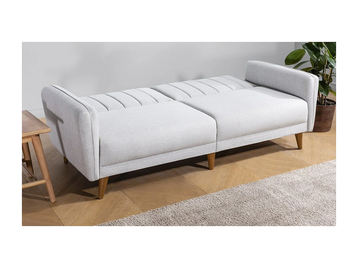 Canapé lit 3 places tissu lin crème et pieds bois naturel Shekal 210cm