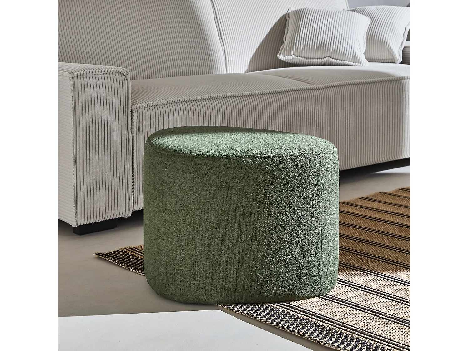 tabouret. pouf en forme de galet en tissu kaki foncé. TAO L 60 x P 44 x H 40cm
