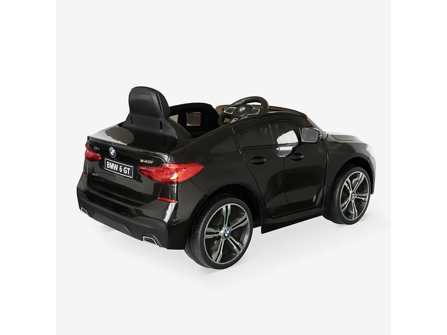 BMW Série 6 GT noire. voiture électrique pour enfants 12V 4 Ah. 1 place. avec autoradio et télécommande
