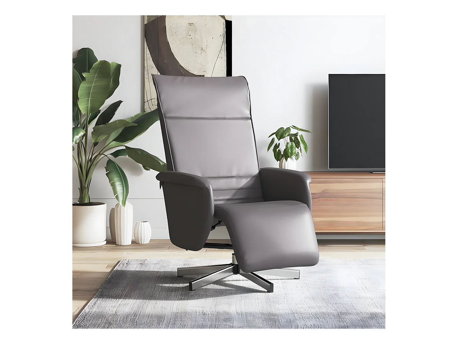 Sillón reclinable con reposapiés de piel sintética gris.