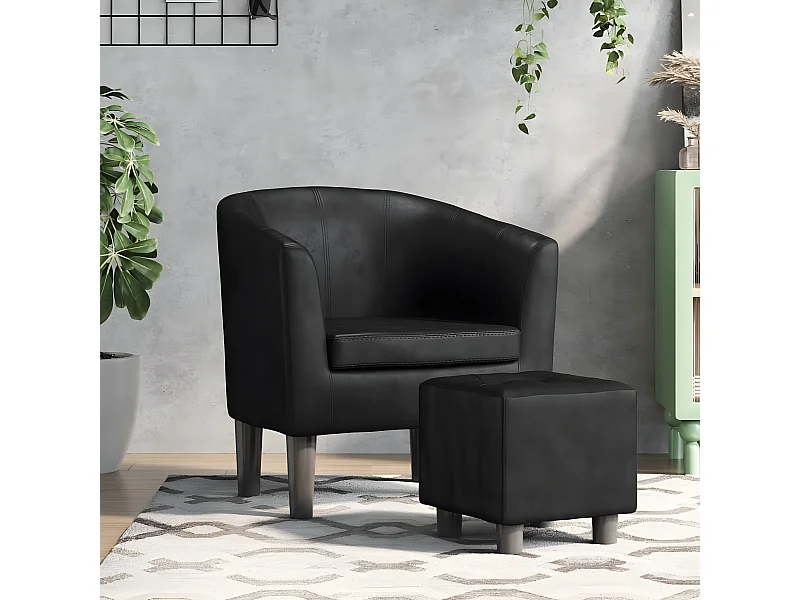 Sillón convertible con reposapiés de piel sintética negra.