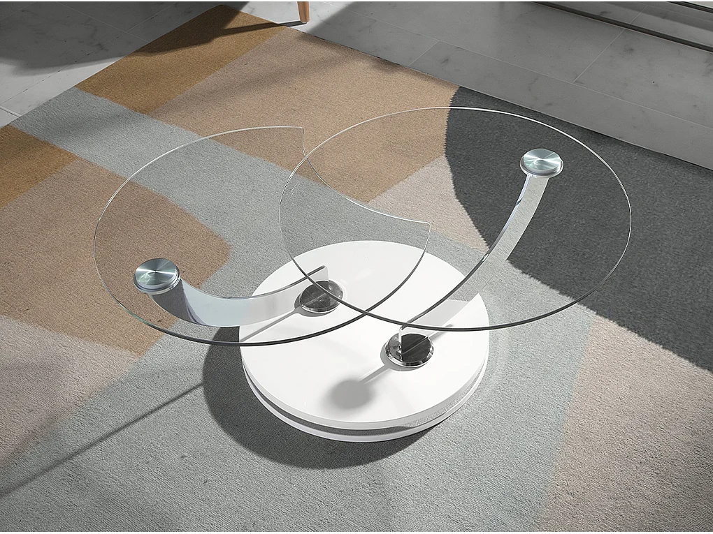 Mesa de café com tampos fixos de vidro temperado com braços giratórios curvos em aço. 2011