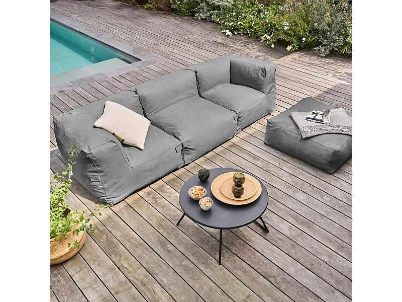 Sofá de esquina modular con 1 sillón, 2 ángulos y 1 puff gris.