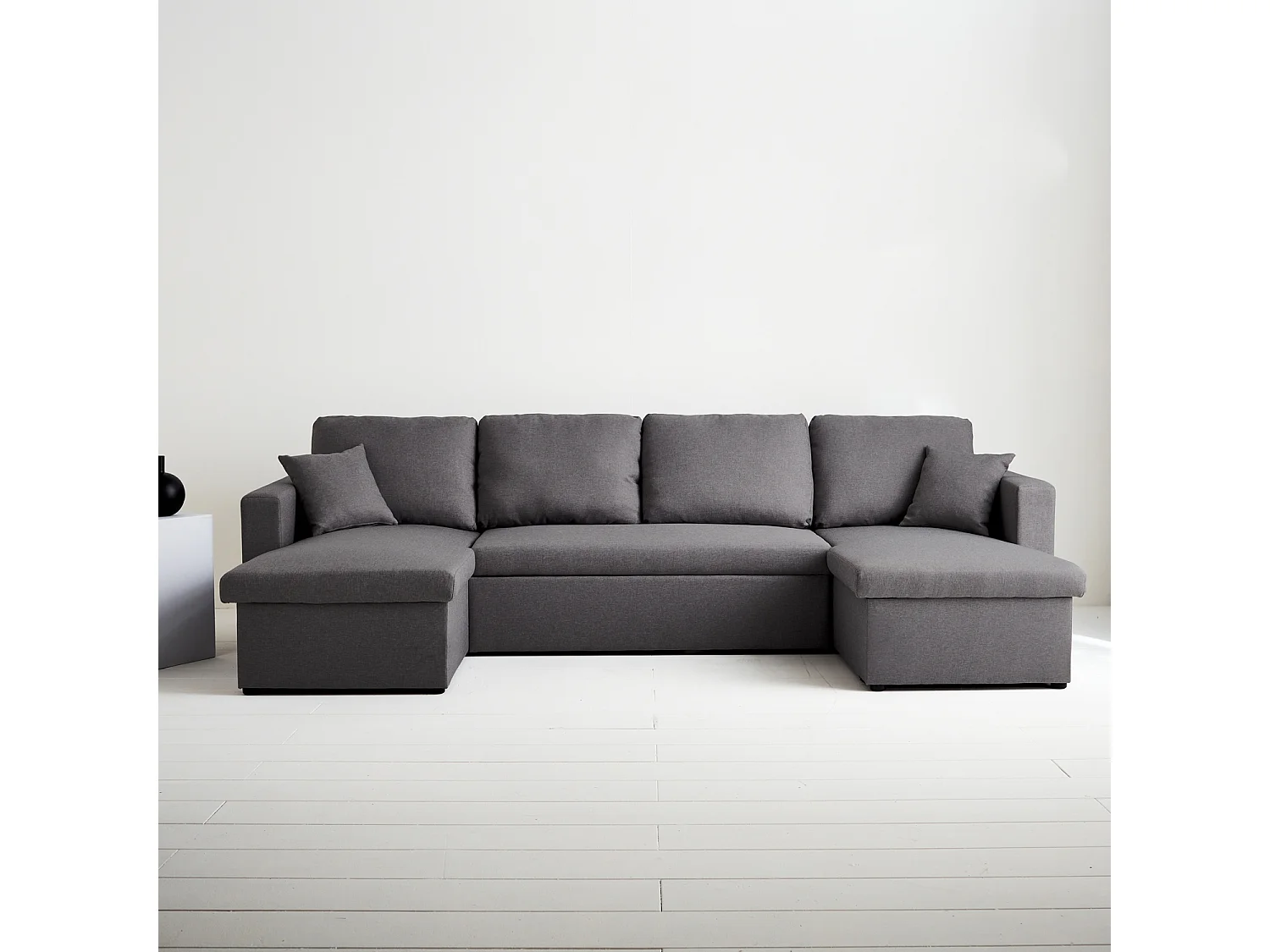 Canapé panoramique convertible en tissu gris foncé. 4 places. coffre rangement. lit modulable