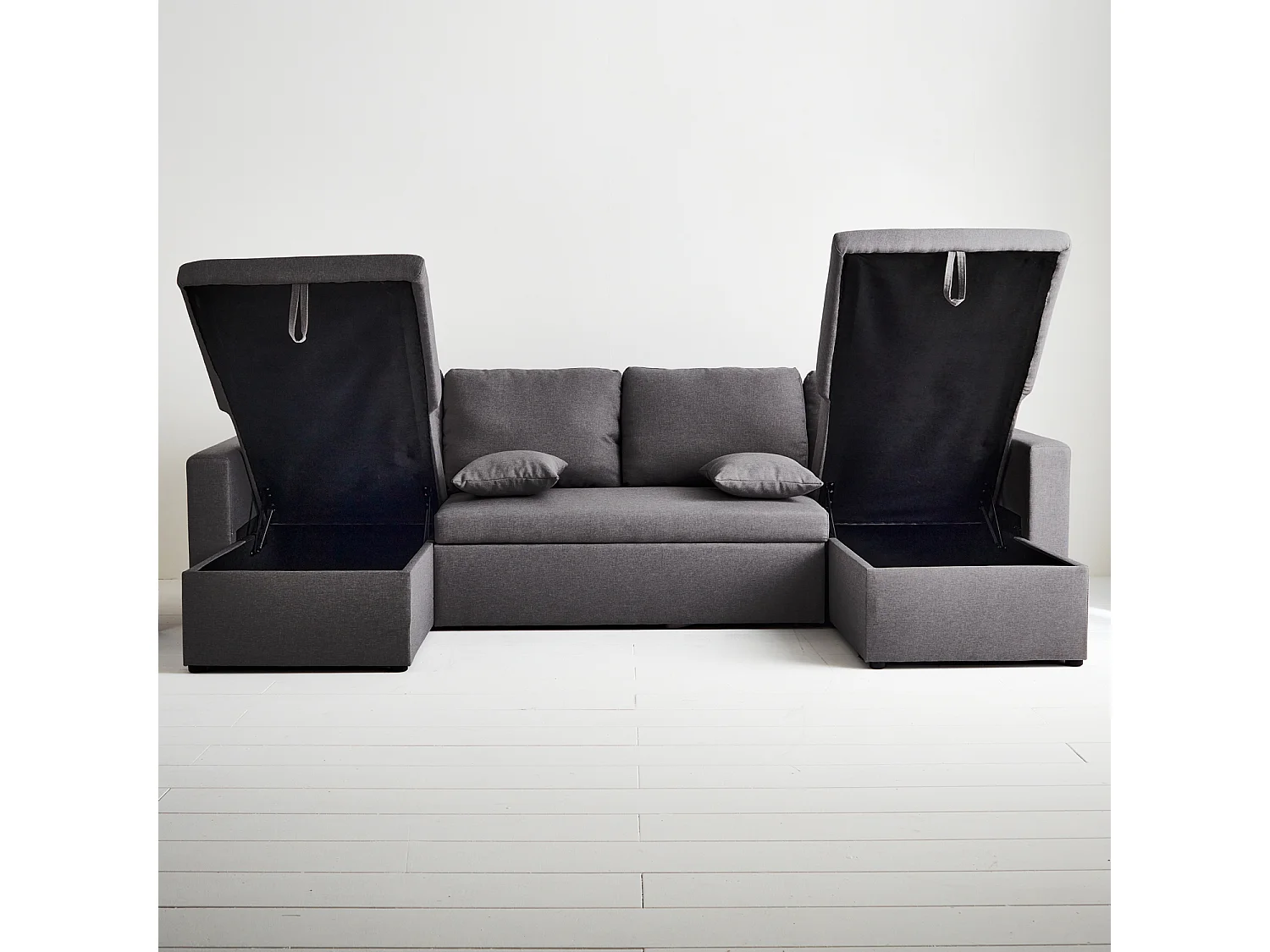 Canapé panoramique convertible en tissu gris foncé. 4 places. coffre rangement. lit modulable