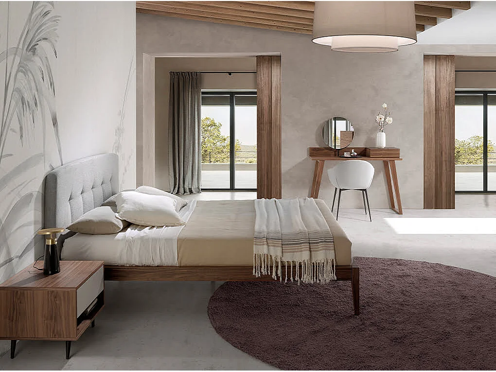 Bett mit grauem Stofftufting