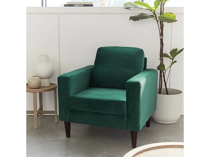 Sillón vintage de terciopelo con patas de madera verde ingles