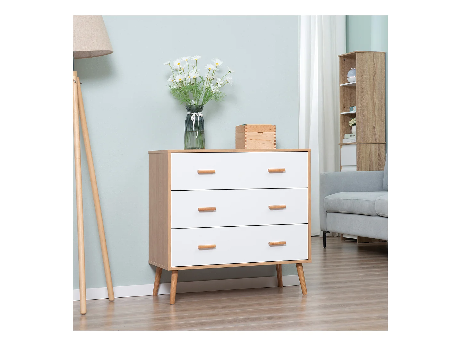 Commode design scandinave sur pieds 3 tiroirs coulissants pieds effilés inclinés panneaux particules blanc aspect bois clair