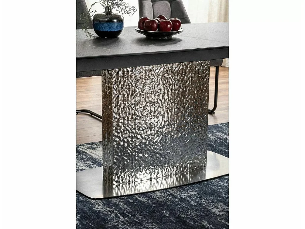 Table design extensible aspect marbre vert avec pied central en acier inoxydable Eglantine