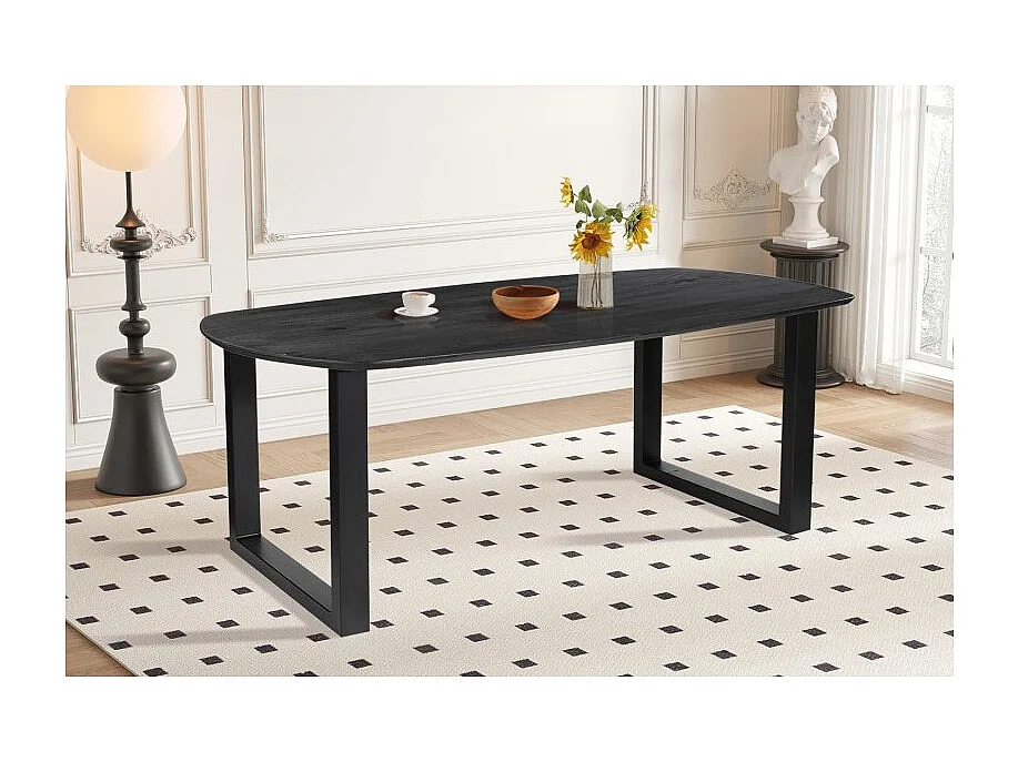 Ovale eettafel voor 8 personen van massief hout in zwarte kleur uit de FRANCHIA collectie. U-vormige designpoten.