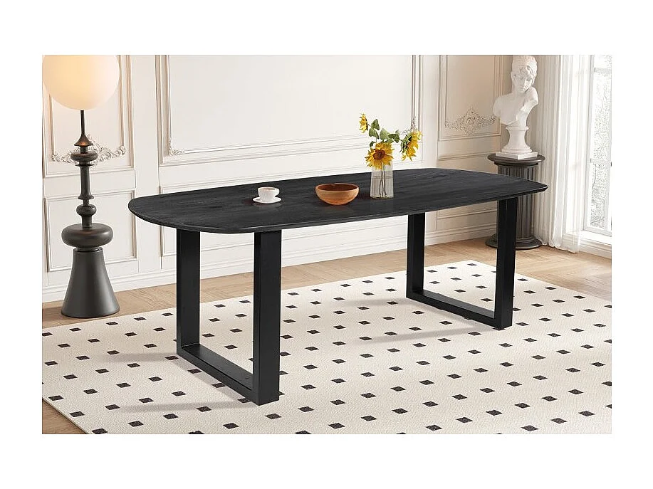 Ovale eettafel voor 8 personen van massief hout in zwarte kleur uit de FRANCHIA collectie. U-vormige designpoten.