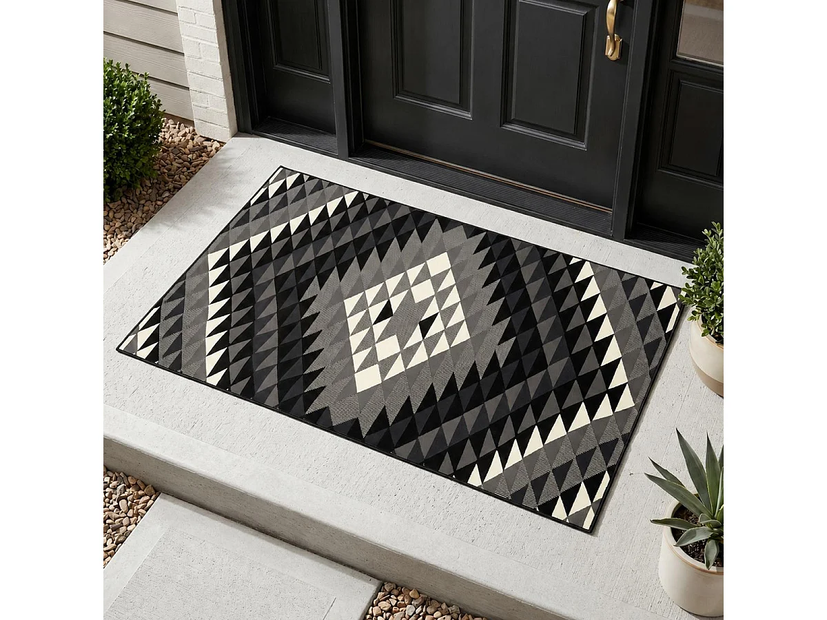 alfombra de dormitorio 60x110 tejida rectangular negra con motivos geométricos LYN49 APACHE