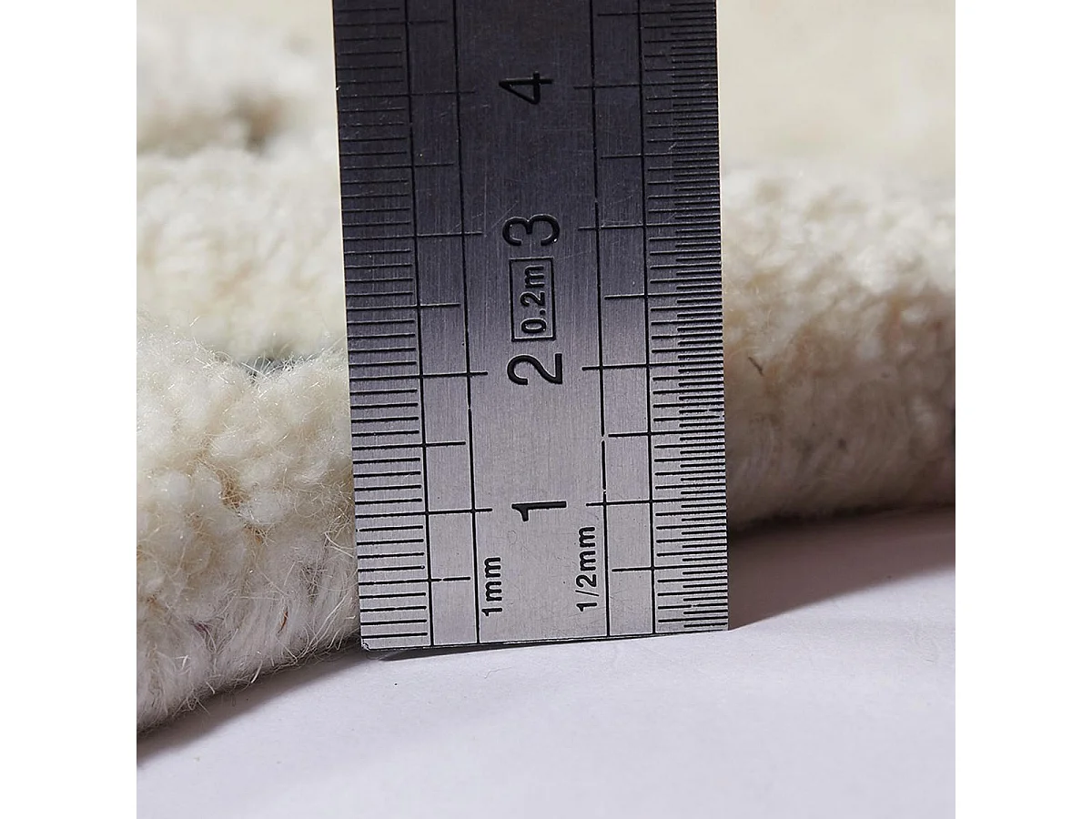 tapis chambre 60x110 fait à la main en laine beige motif traditionnel