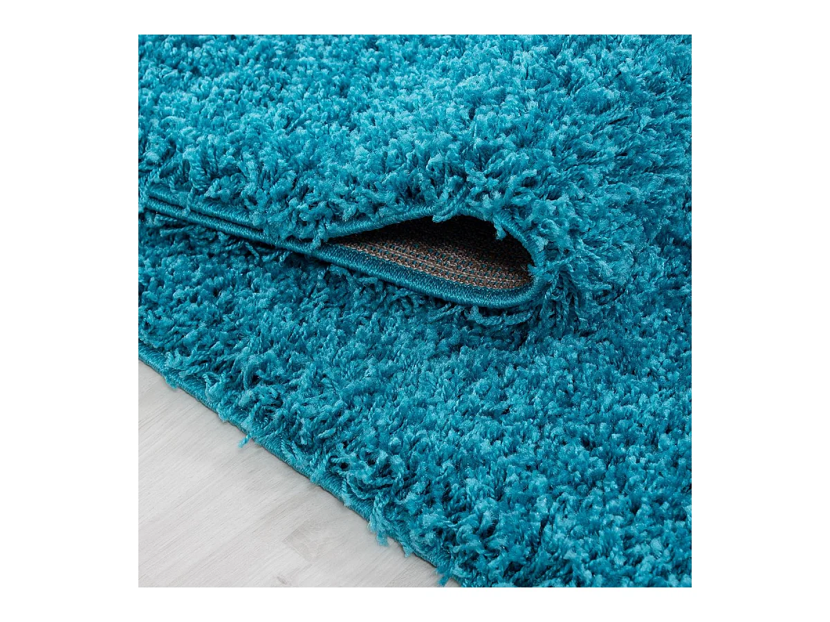 Tapis poils longs shaggy Ø120cm rond tissé turquoise motif uni UNI L