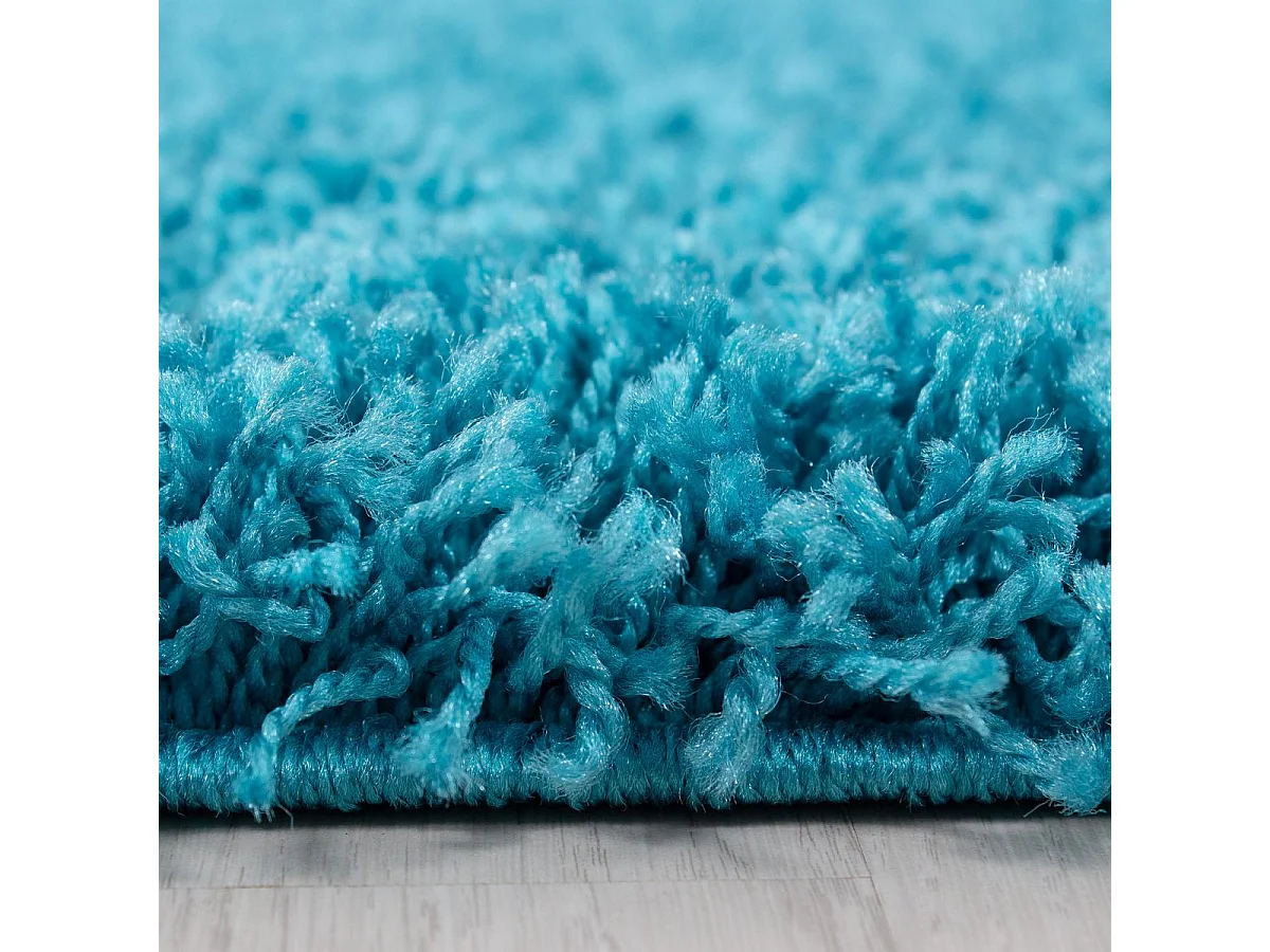 Tapis poils longs shaggy Ø120cm rond tissé turquoise motif uni UNI L