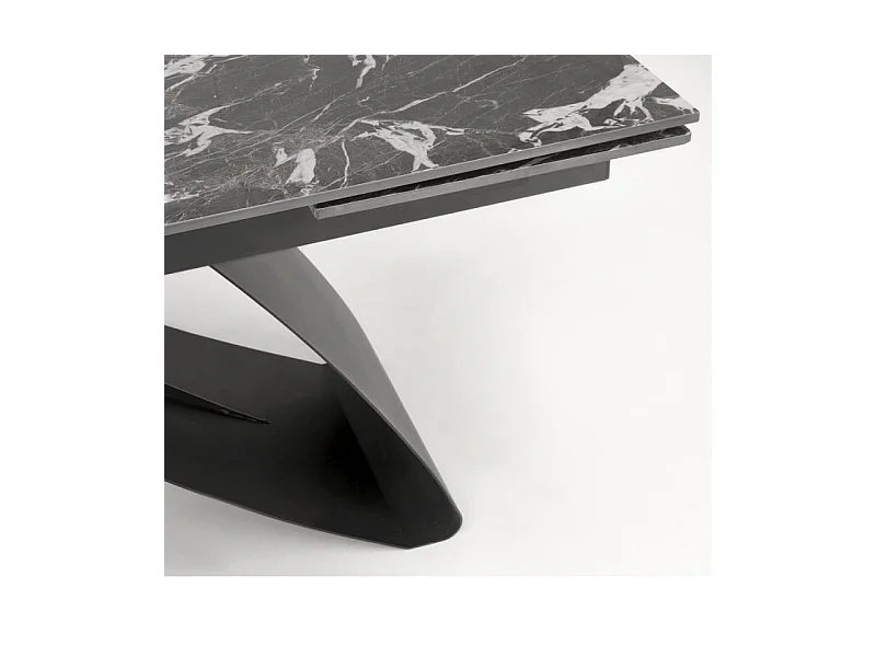 Mesa de comedor extensible Lizzy con tablero de mármol negro y pata central