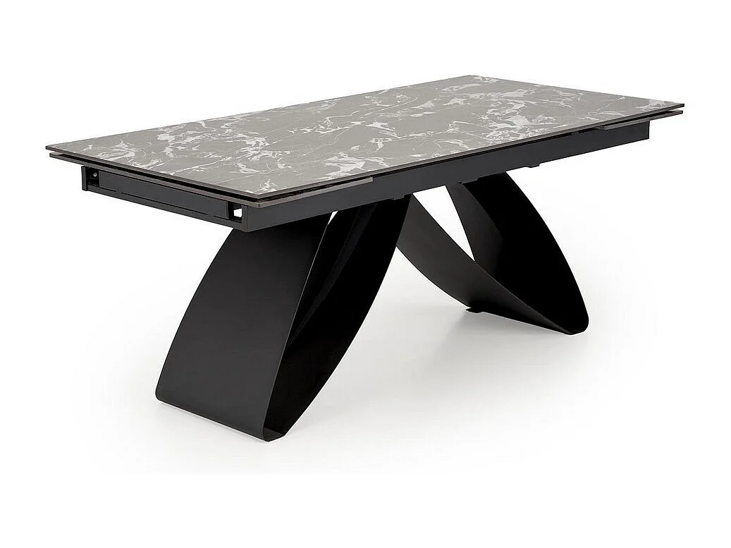 Mesa de comedor extensible Lizzy con tablero de mármol negro y pata central