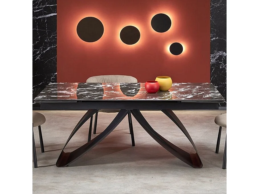 Mesa de comedor extensible Lizzy con tablero de mármol negro y pata central