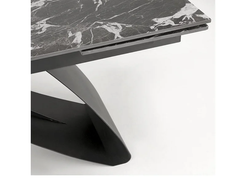 Mesa de comedor extensible Lizzy con tablero de mármol negro y pata central
