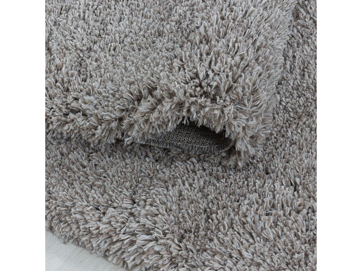 Tapis longs poils shaggy Ø200cm rond tissé beige motif uni UNI B