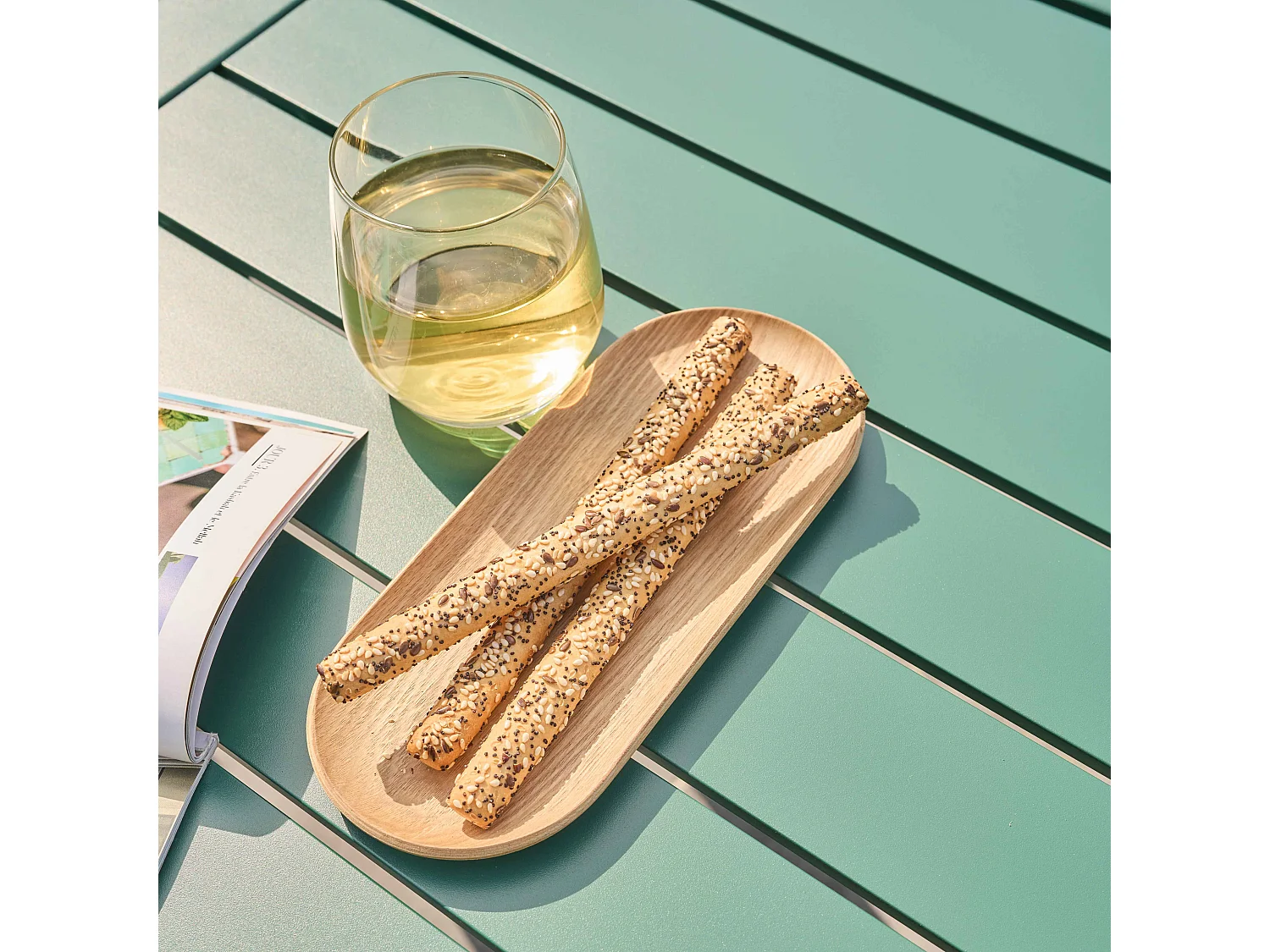 Vierkante terrastafel (185 x 92 cm) en 8 donkergroene fauteuils