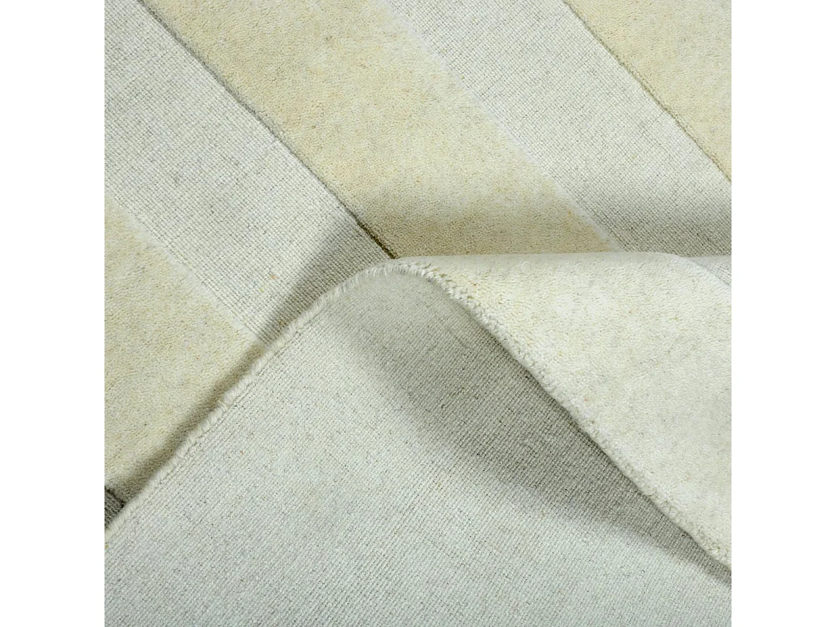 tapis salon 200x290 fait à la main en laine beige rectangle motif uni BANDA