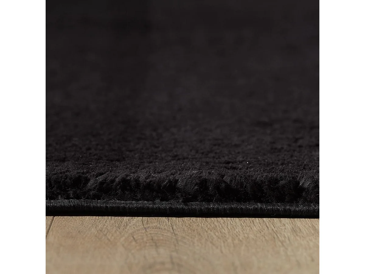 tapis salle de réception Ø80cm tissé noir rond motif uni ANVIK