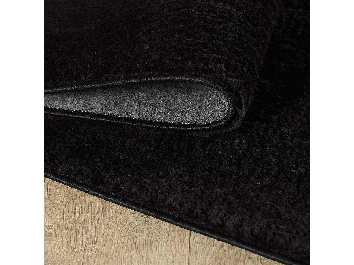 tapis salle de réception Ø80cm tissé noir rond motif uni ANVIK