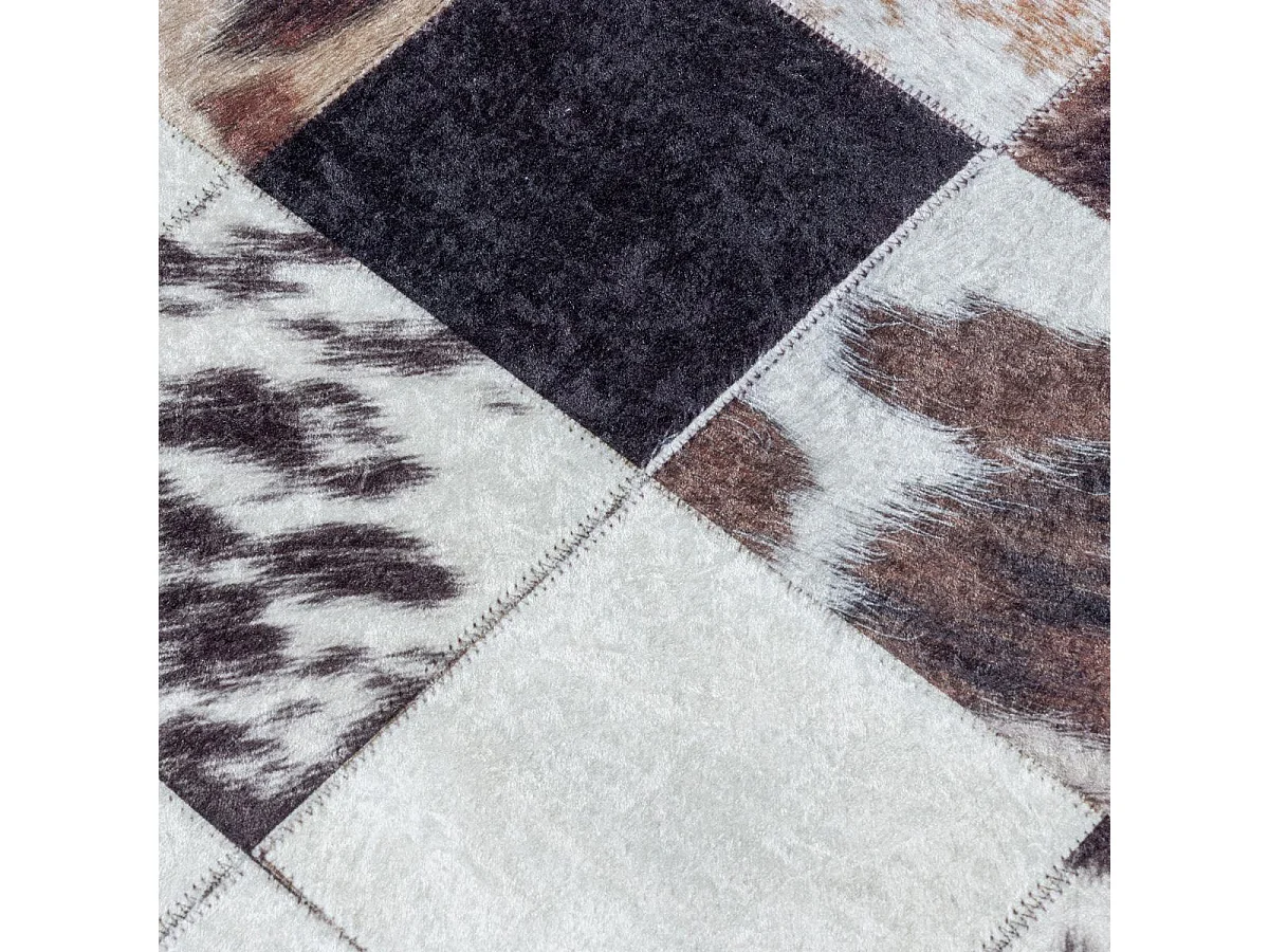 tappeto da soggiorno 140x200 tessuto rettangolare color crema e nero con motivo animalier HUSLIO