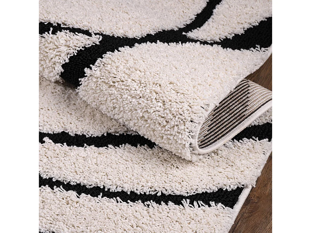 Tapis shaggy Ø120cm rond tissé crème motif géométrique POUDA