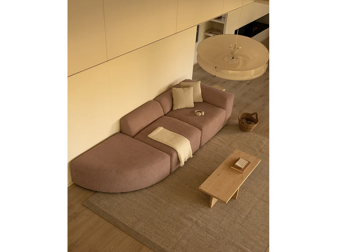 Divano a 3 moduli con curva a sinistra in bouclé rosa 320x110cm