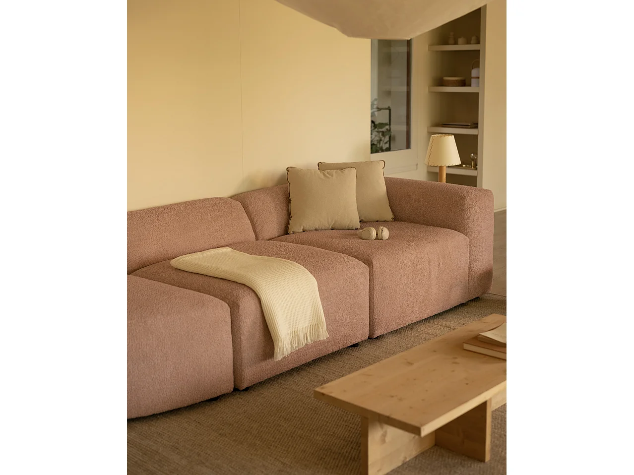 Divano a 3 moduli con curva a sinistra in bouclé rosa 320x110cm