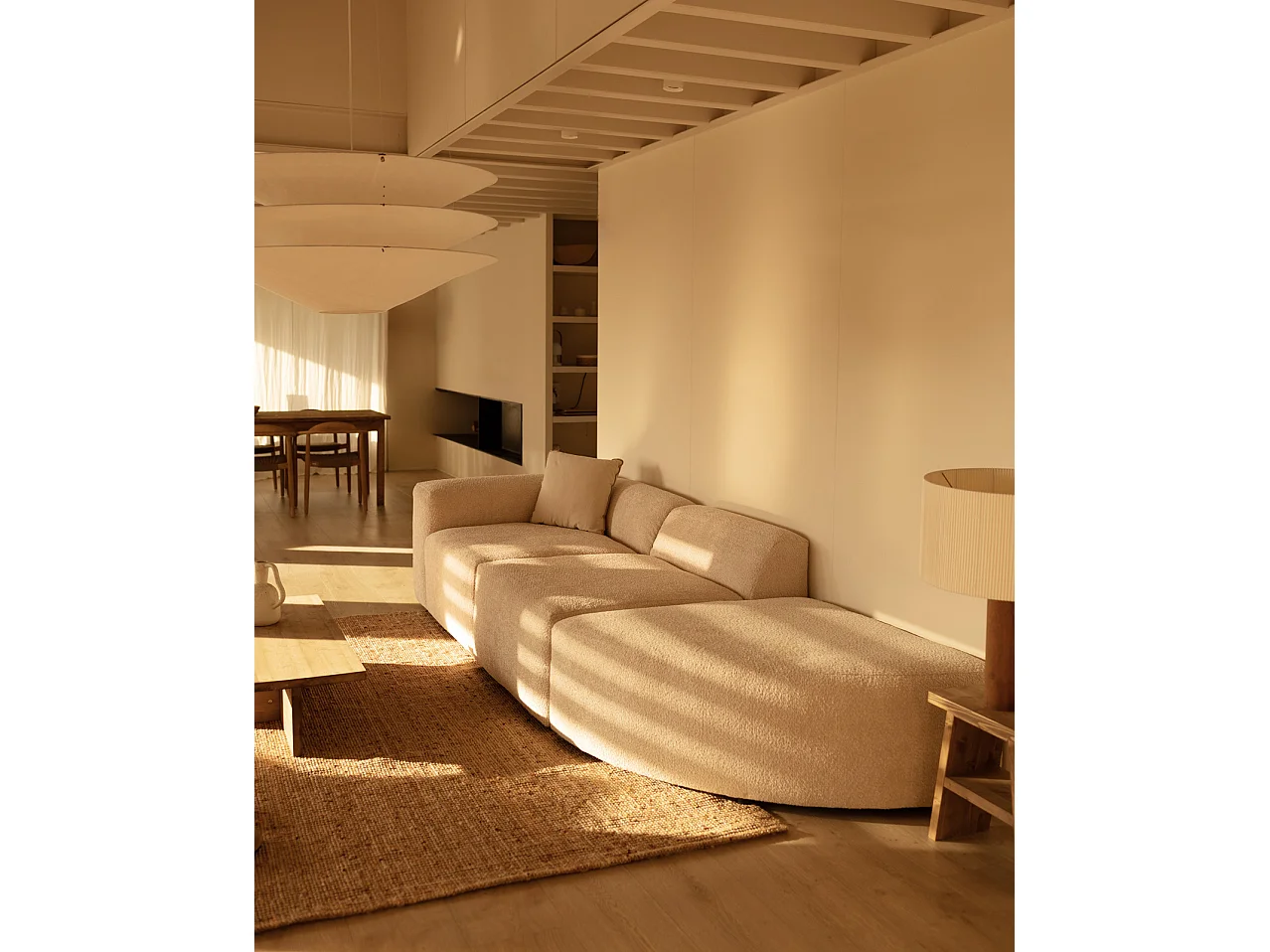 Divano a 3 moduli con curva a destra in bouclé colore beige 320x110cm