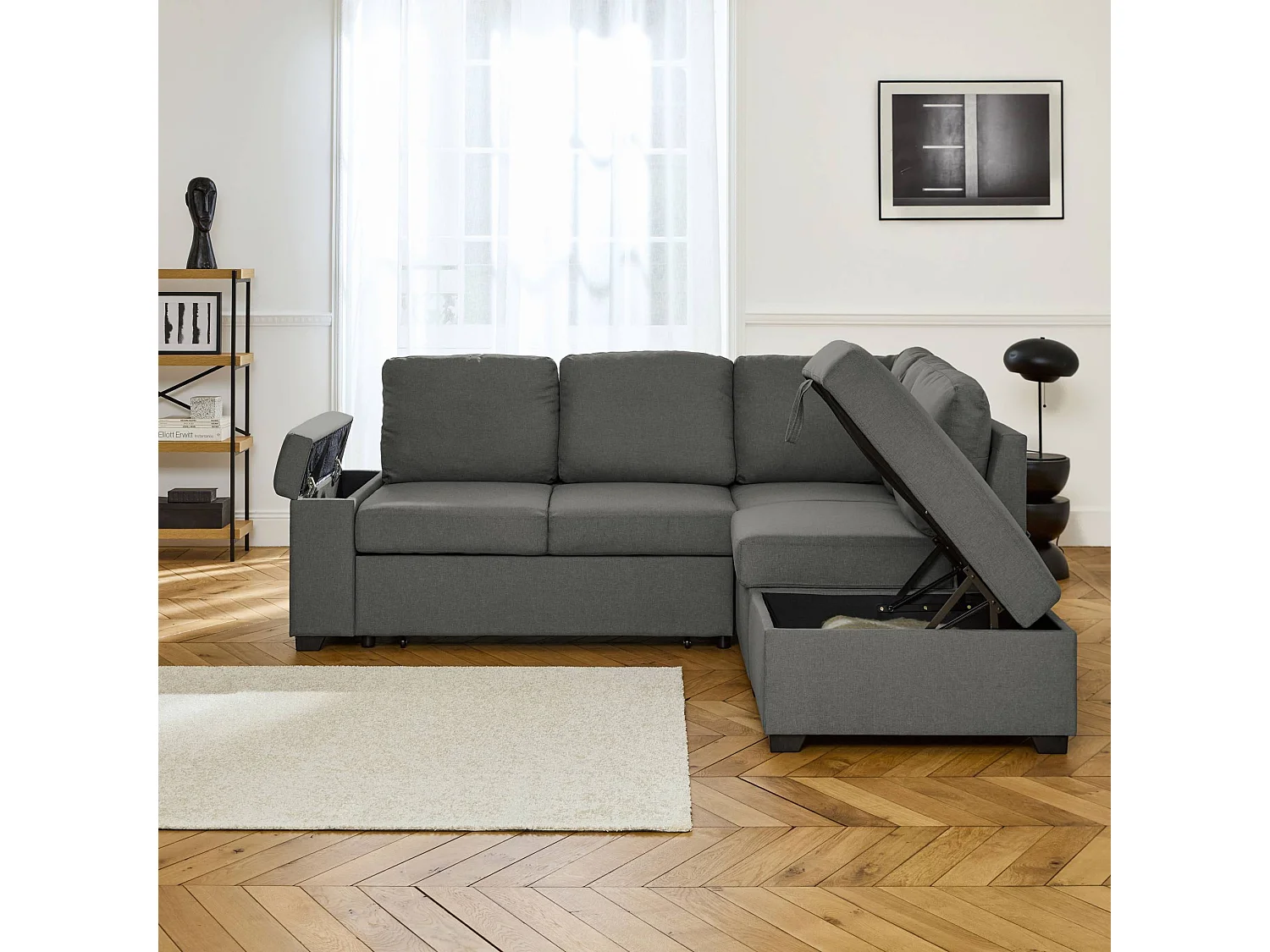 Canapé d'angle convertible. 3 places en tissu gris foncé avec pouf