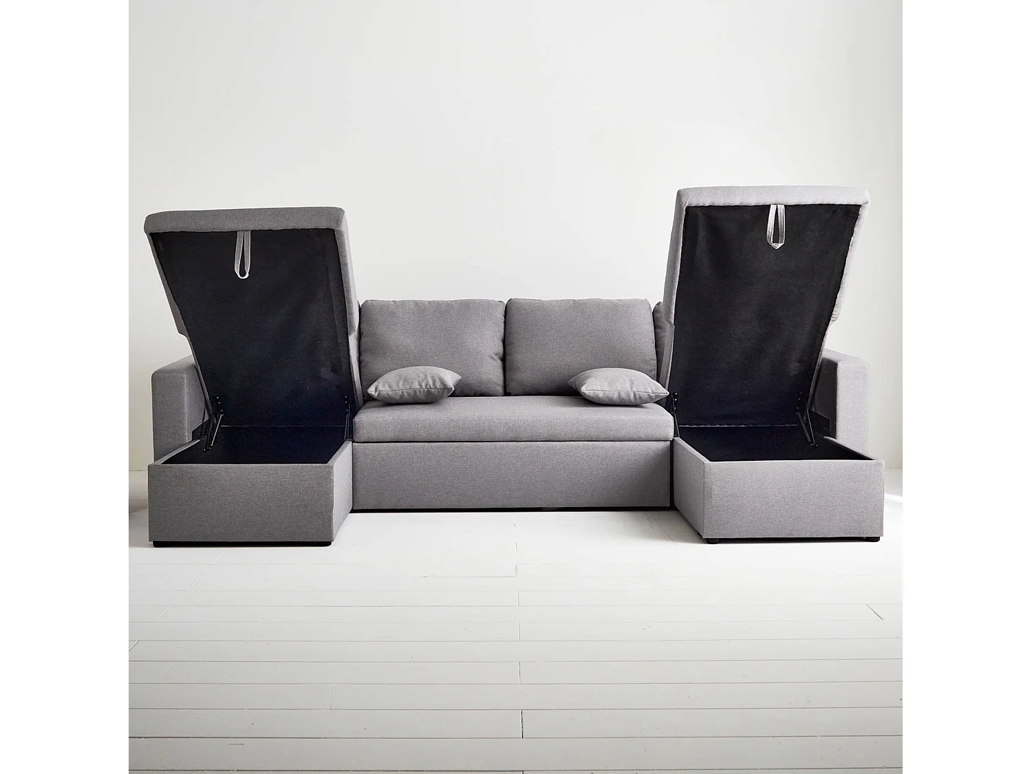 Canapé panoramique convertible en tissu gris clair. 4 places. coffre rangement. lit modulable