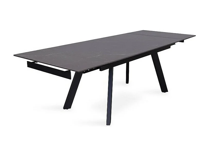 Uitschuifbare eettafel voor 10 personen met een zwart stenen blad uit de LAROS collectie. Structuur van metaal.