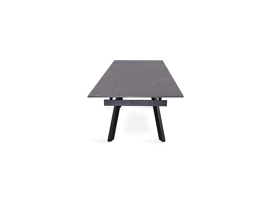Table à manger extensible pour 10 personnes avec plateau en pierre noire collection LAROS. Structure en métal.